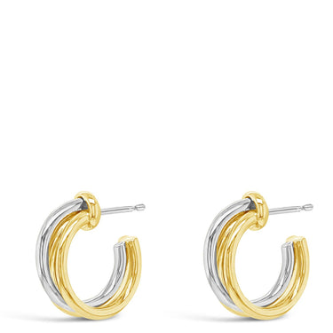 Two gold hoop earrings on a white background