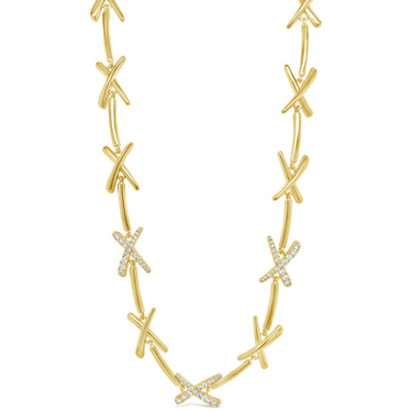 Gold necklace with diamond accents on a white background