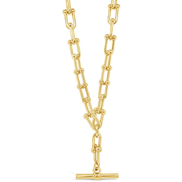 Gold chain necklace with a clasp on a white background