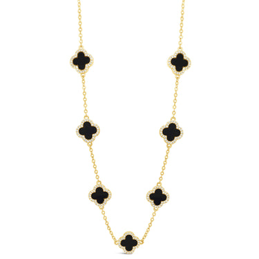 Gold necklace with black clover-shaped pendants on a white background