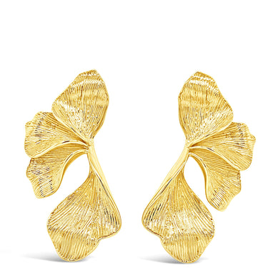 Pair of gold earrings on a white background