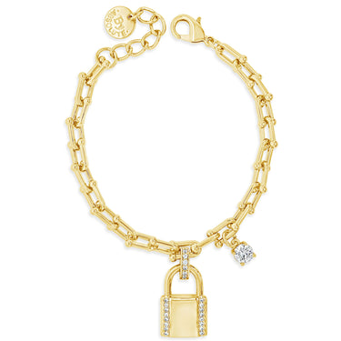 Gold bracelet with lock charm and diamond on a white background