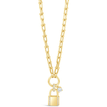 Gold necklace with a lock-shaped pendant on a white background