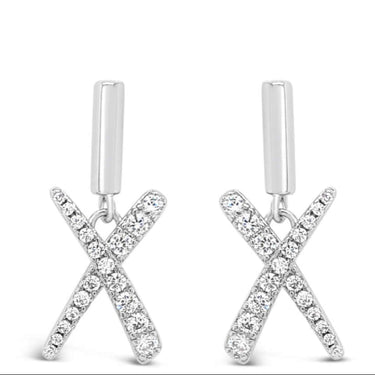 Silver X-shaped earrings on a white background