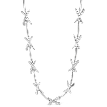 Silver necklace with interlocking design on a white background
