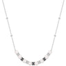 Necklace with pearls and black floral pendants on a white background