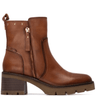 Brown leather boots with a zipper on a white background