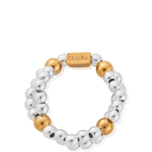 Bracelet with gold and silver beads on a white background