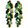 Green gemstone earrings with gold accents on a white background