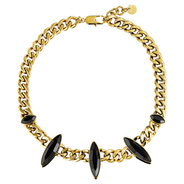 Gold chain necklace with black gemstones on a white background