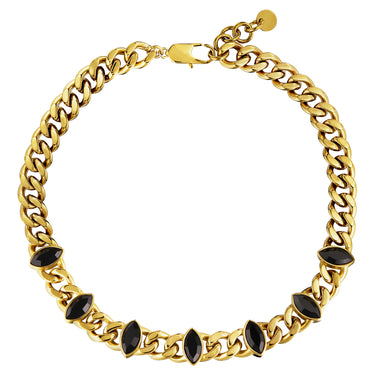 Gold chain necklace with black gemstones on a white background