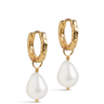 Gold hoop earrings with white pearl drops on a white background