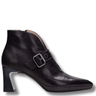 Black leather ankle boot with a buckle on a white background