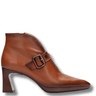 Brown leather ankle boot with a buckle on a white background