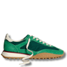 Green sneaker with white laces on a white background