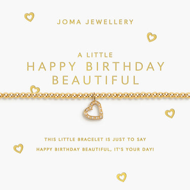 Gold bracelet with heart charm on a Joma Jewellery card
