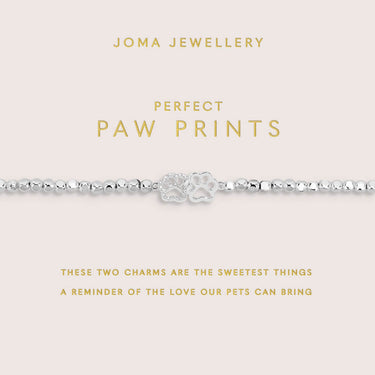 Joma Jewellery bracelet with paw print charms on a pink card