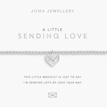 Silver bracelet with heart charm on a Joma Jewellery card.