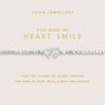 Joma Jewellery bracelet with heart charms on a pink card