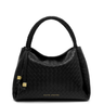 Black quilted handbag with braided handle on a white background