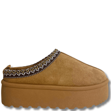 Brown slipper with platform sole on a white background
