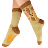 Pair of socks with autumn leaf design on a beige background