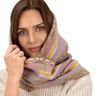 Woman wearing a colorful patterned scarf on a white background