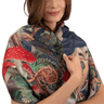 Woman wearing a colorful scarf with nature-themed design