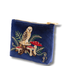 Blue pouch with embroidered owl and mushrooms design on a white background