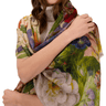 Woman wearing a floral scarf on a white background