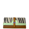 Clutch bag with zebra pattern and brown leather strap on a white background