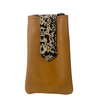 Brown leather pouch with a leopard print strap on a white background