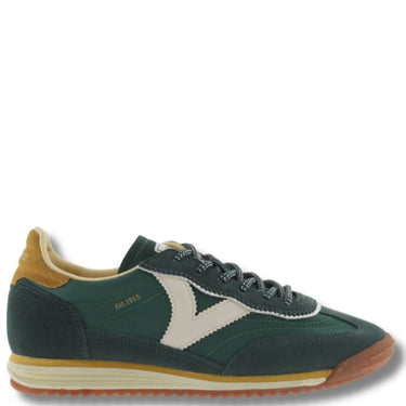 Green sneaker with a white logo on a white background