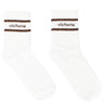 Two white socks with brown stripes and 'victoria' branding on a white background