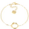 Gold bracelet with star and circle charm on a white background