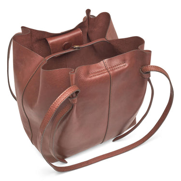 Brown leather handbag with a shoulder strap on a white background