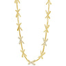 Gold necklace with diamond accents on a white background