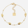 Gold bracelet with a square tag on a white background