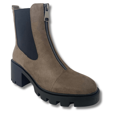 Brown suede boot with a black sole on a white background