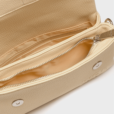 Beige handbag with a zipper on a light gray background