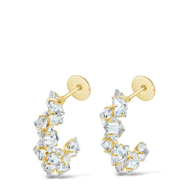 Gold and diamond earrings on a white background