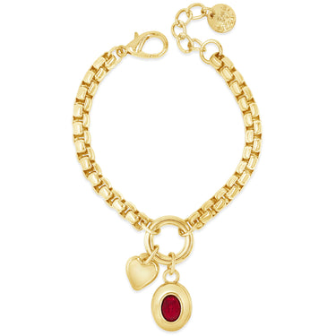 Gold bracelet with heart and round charm on a white background