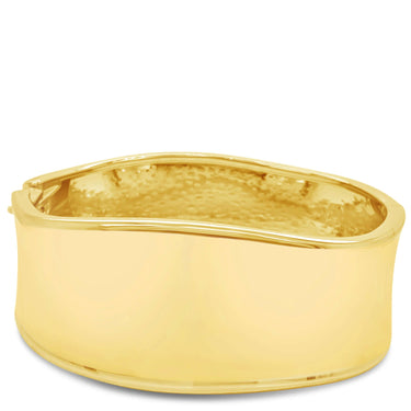 Gold bangle on a white background