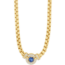 Gold necklace with a blue gemstone and clear stones on a white background