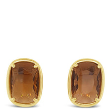 A pair of gold stud earrings with cushion-cut brown gemstones, set against a plain white background.