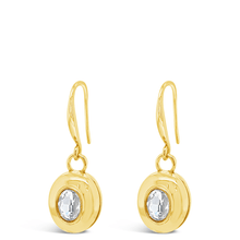Gold earrings with clear gemstones on a white background