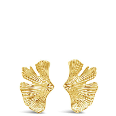Gold leaf-shaped earrings on a white background
