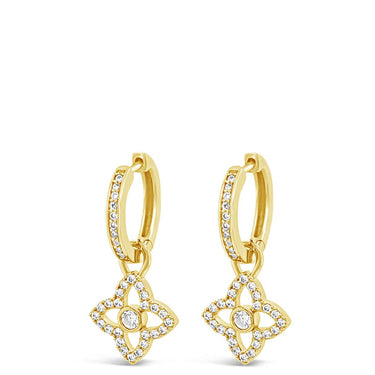 Gold earrings with diamond-like pendants on a white background