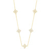 Gold necklace with diamond-like pendants on a white background