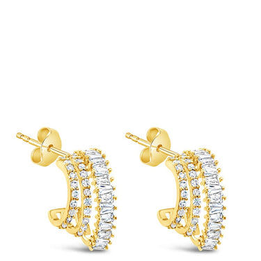 Gold hoop earrings on a white background